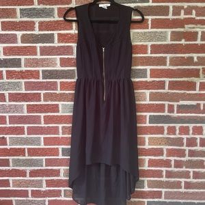 Black Dress with zipper on the chest and open back. Size is a medium.